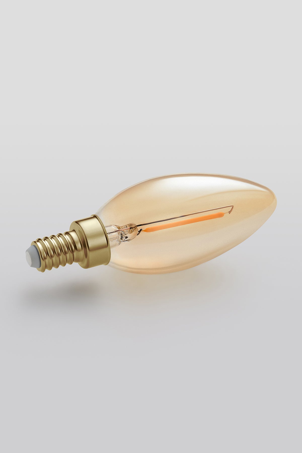 Modern candelabra LED light bulb with warm vintage Edison style glow