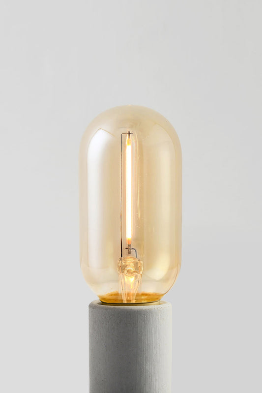 Modern T14 LED light bulb with warm vintage Edison style glow