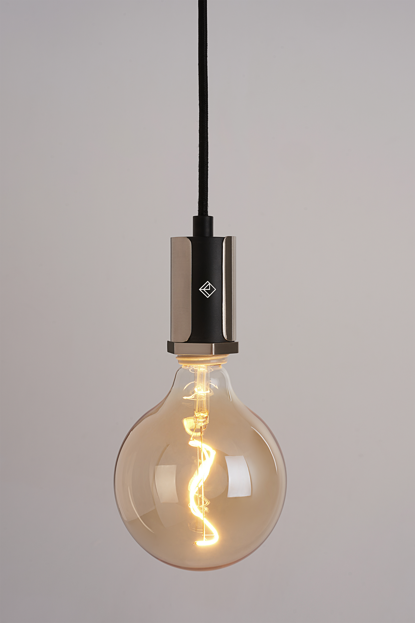 The Alamere Plug-In Pendant is the ideal ceiling pendant lamp for any space. Easy to install, it plugs into any standard wall outlet and comes with two cord anchors to hang it anywhere. An inline dimmer on the cord allows for adjustability with any compatible dimming light bulb.