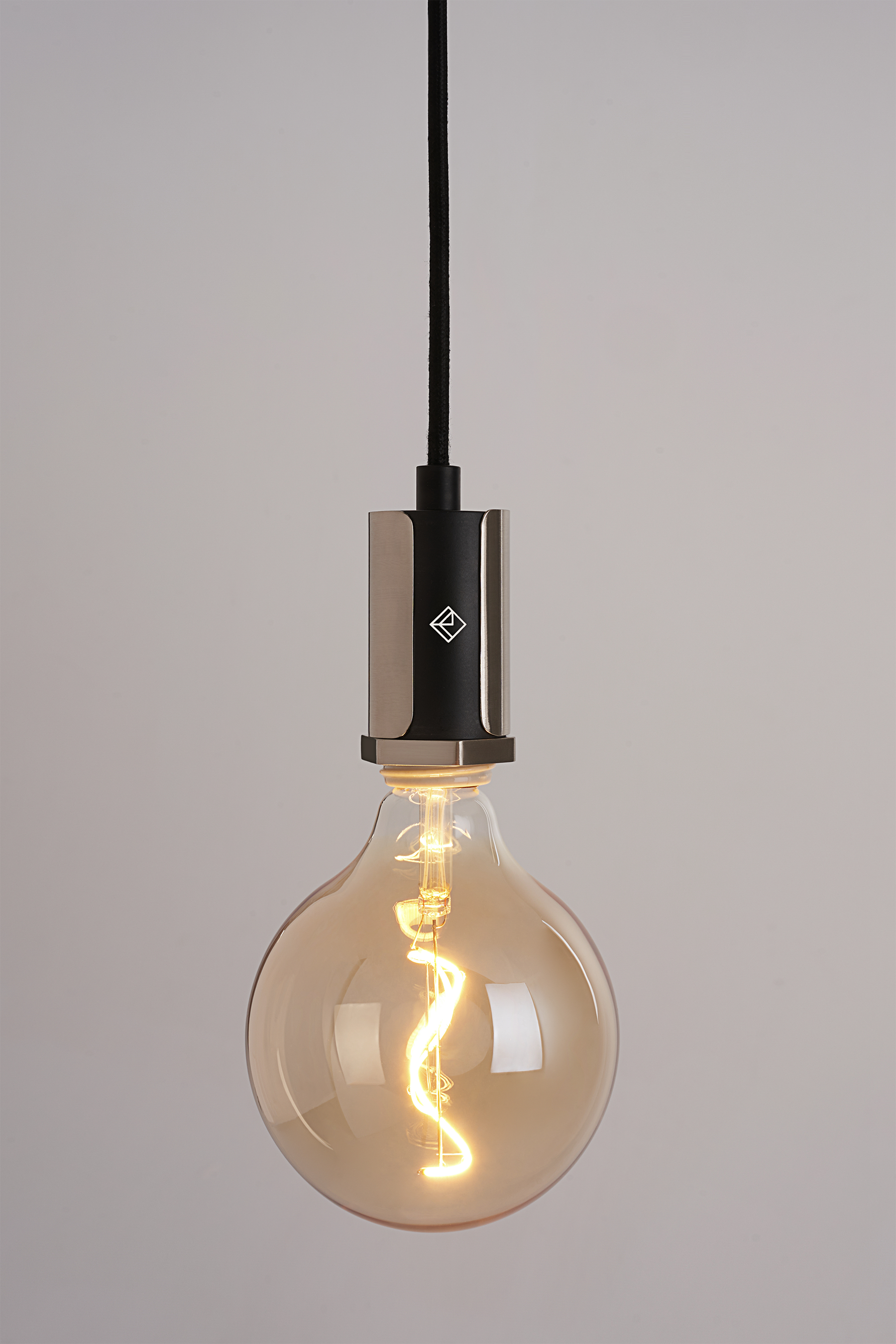 The Alamere Plug-In Pendant is the ideal ceiling pendant lamp for any space. Easy to install, it plugs into any standard wall outlet and comes with two cord anchors to hang it anywhere. An inline dimmer on the cord allows for adjustability with any compatible dimming light bulb.