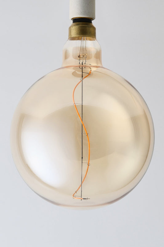 Oversized globe LED bulb with warm vintage Edison style glow