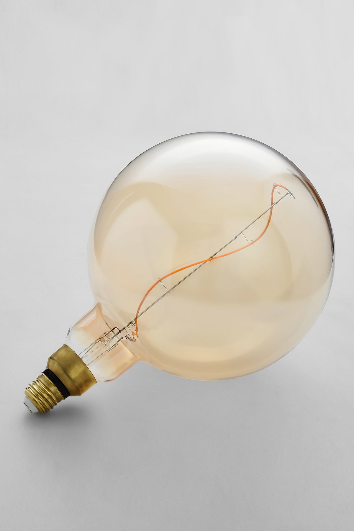 Oversized globe LED bulb with warm vintage Edison style glow