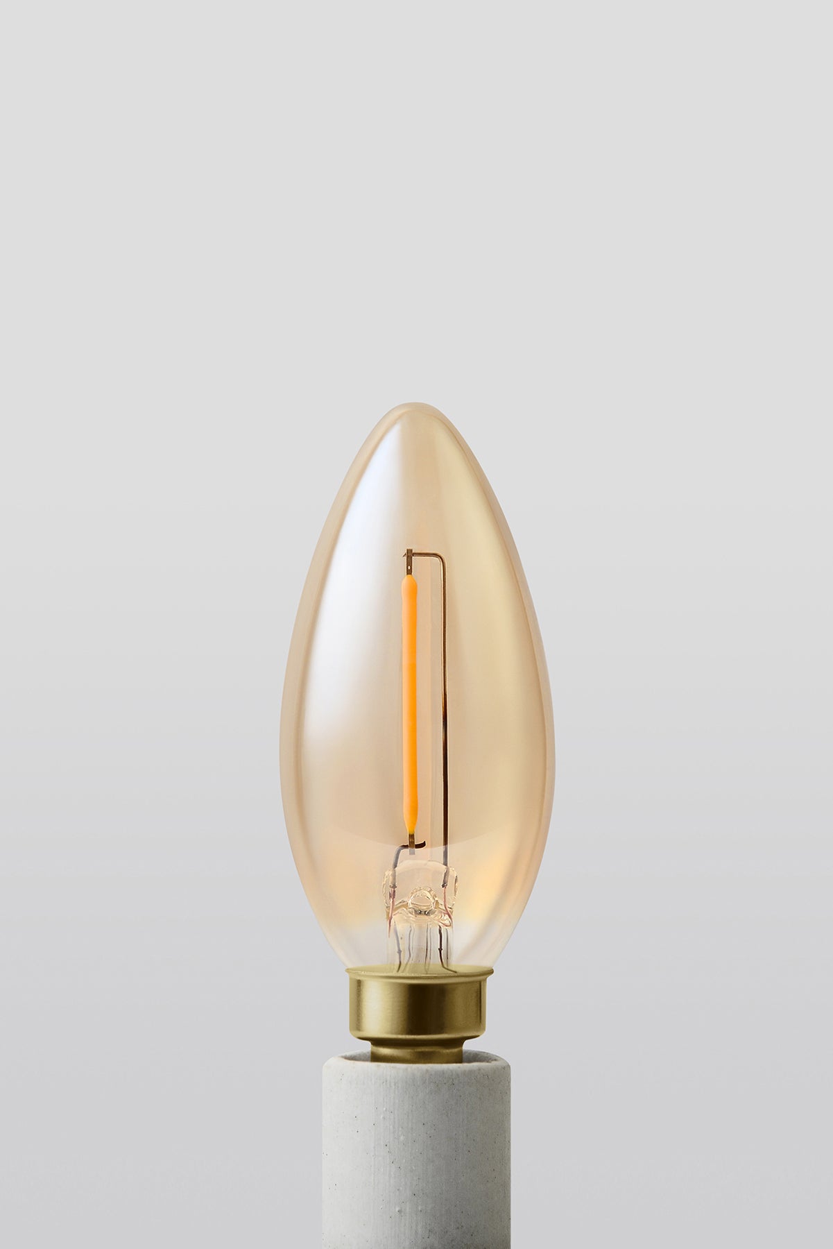 Modern candelabra LED light bulb with warm vintage Edison style glow