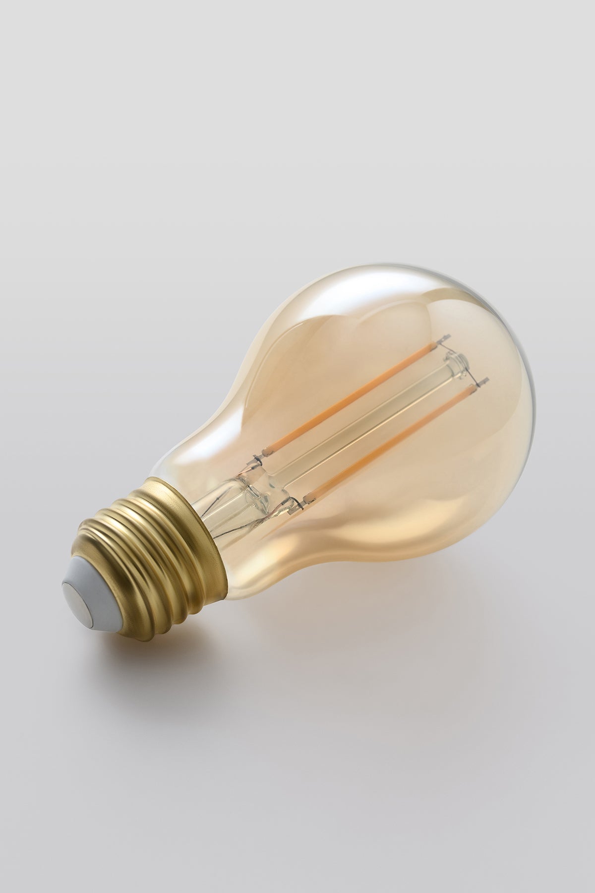 Modern A19 LED light bulb with warm vintage Edison style glow
