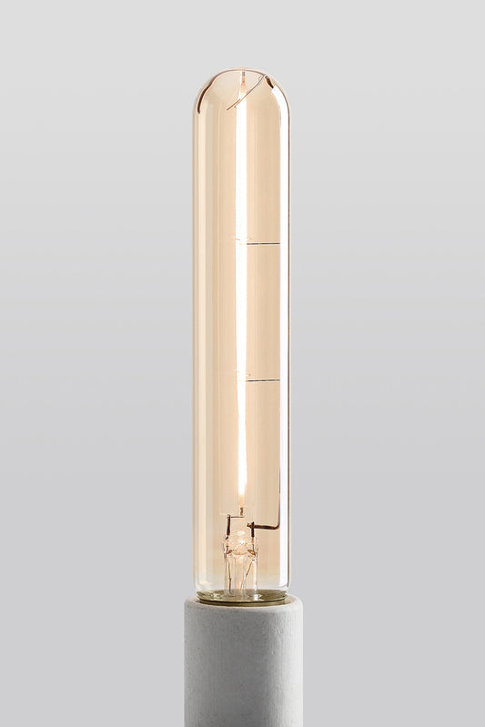 Modern T9 LED light bulb with warm vintage Edison style glow