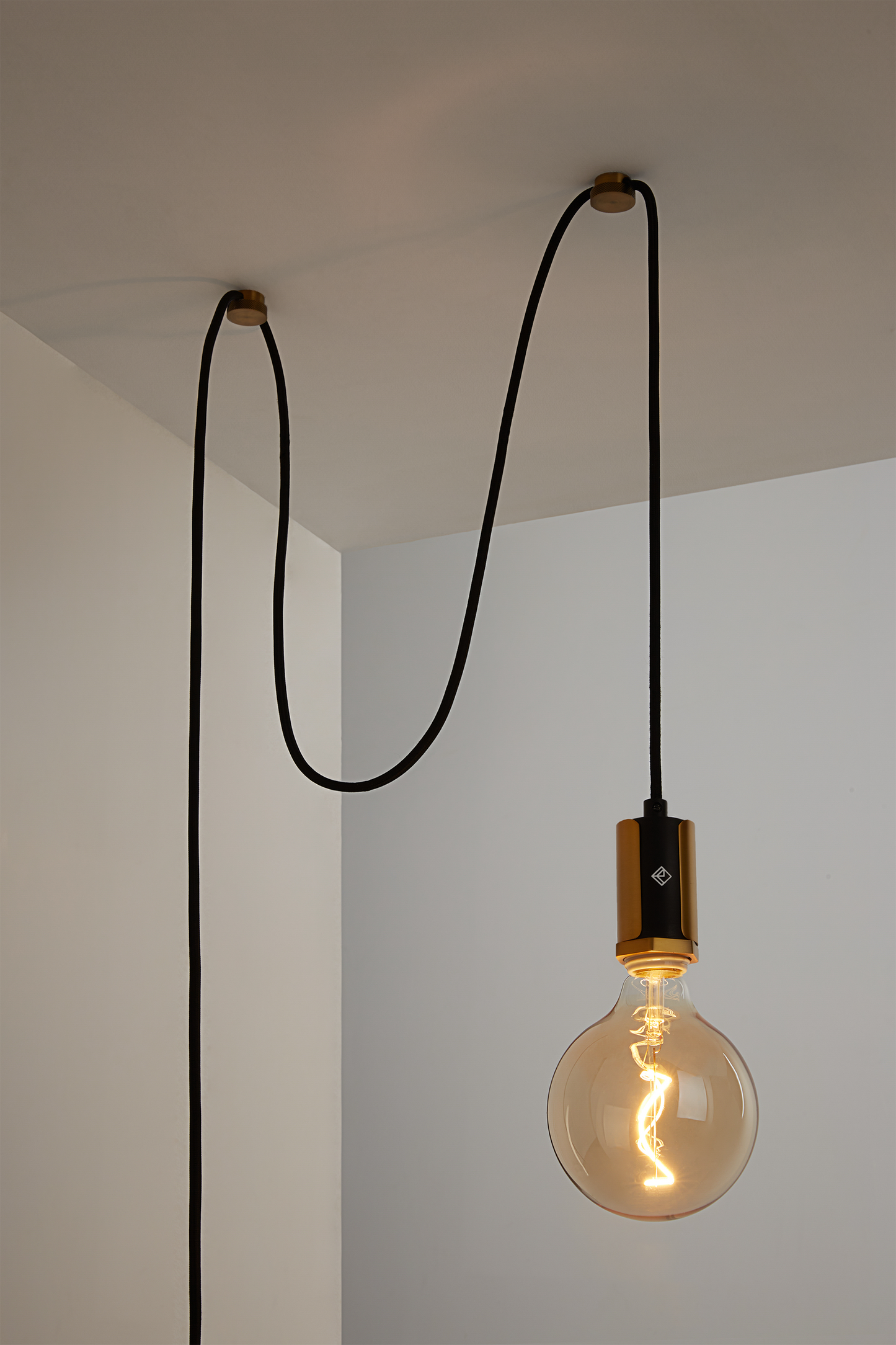 The Alamere Plug-In Pendant is the ideal swag kit lamp for any space. Easy to install, it plugs into any standard wall outlet and comes with two cord anchors to hang it anywhere. An inline dimmer on the cord allows for adjustability with any compatible dimming light bulb.